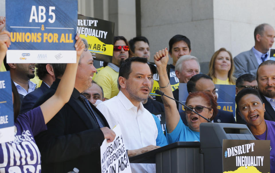 Assembly Speaker Anthony Rendon, D-Lakewood, speaks in support of a bill to limit when companies can label workers as independent contractors, during a rally in Sacramento, Calif., Wednesday, July 10, 2019. The measure, AB5 by Assemblywoman Lorena Gonzalez, D-San Diego, is aimed at major employers like Uber and Lyft, was approved by a Senate committee and still needs approval by the full Senate. (AP Photo/Rich Pedroncelli)