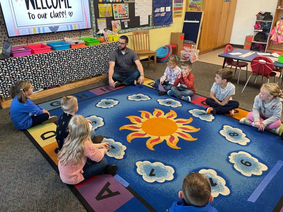 Veteran Steven Copp speaks with students at the Gonic School on Thursday as veterans visited classrooms to explain to students why Veterans Day is a national holiday.