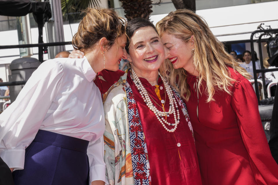 Director Alice Rohrwacher, from left, Isabella Rossellini and Alba Rohrwacher pose for photographers upon arrival at the premiere of the film 'La Chimera' at the 76th international film festival, Cannes, southern France, Friday, May 26, 2023. (Photo by Scott Garfitt/Invision/AP)