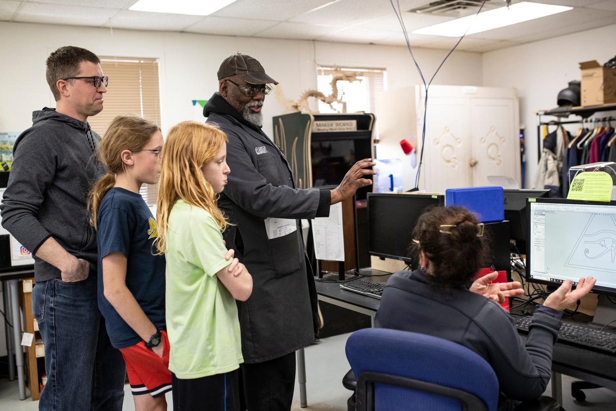 Maker Works staff member Randy Williams gives a tour to the Pyles family, of Saline, during Fix-It Friday at Maker Works in Ann Arbor on Friday, April 19, 2024.
