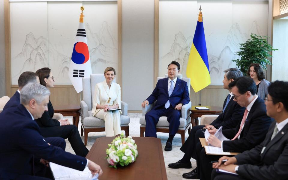 South Korean President Yoon Suk Yeol talking with Ukraine's First Lady Olena Zelenska - HANDOUT/AFP