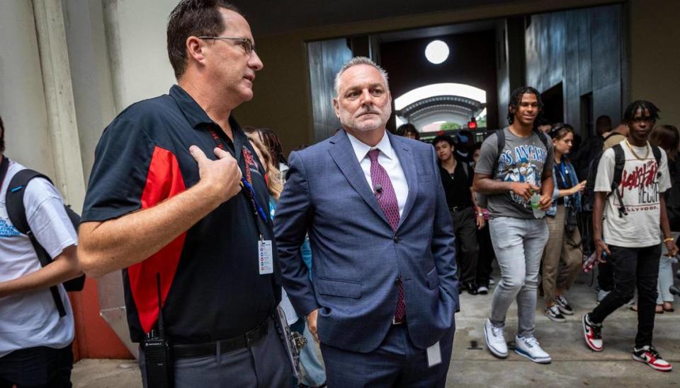 Coconut Creek, August 21, 2023 - Broward Schools Superintendent Peter Licata, center, talks to Monarch High School’s principal James Cecil, left, as students file into the building for the first day of school in Broward County.