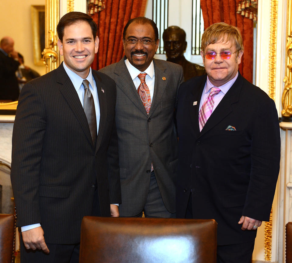 WASHINGTON, DC - JULY 24:  (L-R) U.S. Senator Marco Rubio (R-FL), UNAIDS Executive Director Michel Sidibe, and Sir Elton John meet after The Elton John AIDS Foundation and UNAIDS breakfast at the Russell Senate Office Building on July 24, 2012 in Washington, DC.  (Photo by Michael Kovac/Getty Images for The Elton John AIDS Foundation)
