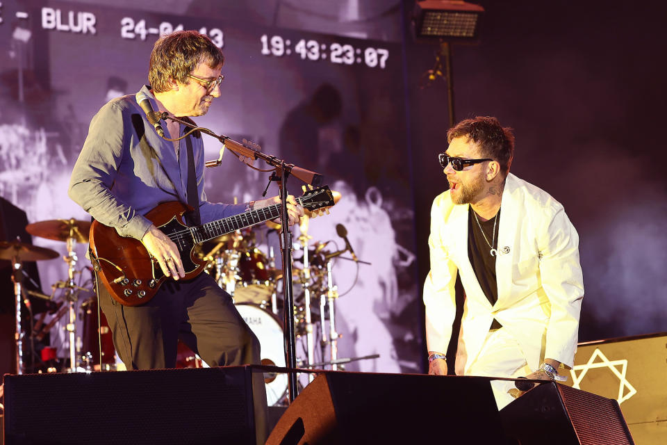 INDIO, CALIFORNIA - APRIL 13: (FOR EDITORIAL USE ONLY) (L-R) Graham Coxon and Damon Albarn of Blur perform at the Coachella Stage during the 2024 Coachella Valley Music and Arts Festival at Empire Polo Club on April 13, 2024 in Indio, California. (Photo by Arturo Holmes/Getty Images for Coachella)