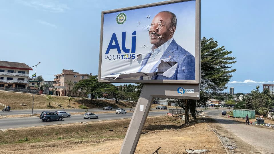 A torn campaign billboard shows ousted Gabon President Ali Bongo Ondimba in Libreville on August 31, 2023. - AFP/Getty Images