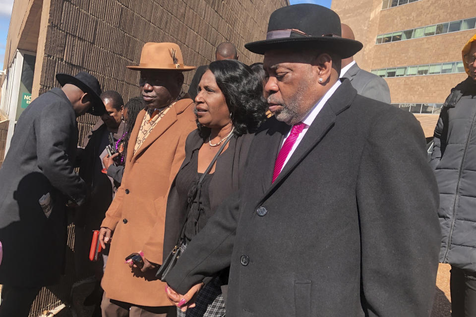 From left, attorney Ben Crump, Tyre Nichols’ mother, RowVaughn Wells, and stepfather, Rodney Wells exit the courthouse on Friday, Feb. 17, 2023 in Memphis, Tenn. Five former Memphis police officers pleaded not guilty Friday to second-degree murder and other charges in the violent arrest and death of Tyre Nichols, with the judge urging patience in a case that could "take some time.” (AP Photo/Adrian Sainz)