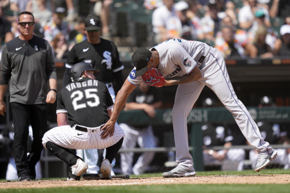 Miami Marlins starting pitcher Sandy Alcantara pats Chicago White Sox's Andrew Vaughn after Alcantara hit Vaughn with a pitch during the sixth inning of a baseball game Saturday, June 10, 2023, in Chicago. (AP Photo/Charles Rex Arbogast)
