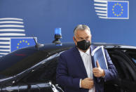 FILE - In this Oct. 15, 2020, file photo, Hungary's Prime Minister Viktor Orban arrives for an EU summit at the European Council building in Brussels. The European Union still hasn't completely sorted out its messy post-divorce relationship with Britain — but it has already been plunged into another major crisis. This time the 27-member union is being tested as Poland and Hungary block passage of its budget for the next seven years and an ambitious package aimed at rescuing economies ravaged by the coronavirus pandemic. (AP Photo/Olivier Matthys, Pool, File)