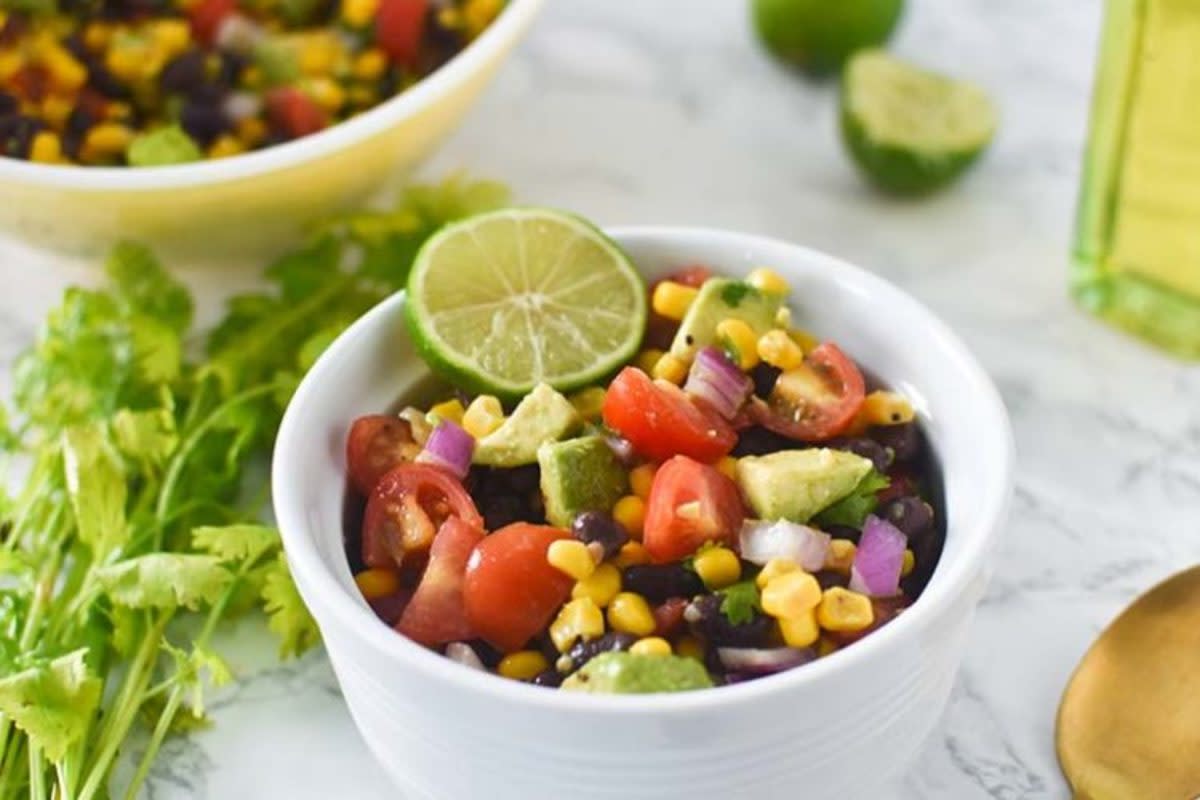 <p>I Can You Can Vegan</p><p>This Easy Avocado Black Bean Corn Salad is light, fresh and the perfect side dish to accompany your favorite recipes. A simple summer salad seasoned with cilantro, smoked paprika and lime juice.</p><p><strong>Get the recipe: <a href="https://www.icanyoucanvegan.com/easy-avocado-black-bean-corn-salad/" rel="nofollow noopener" target="_blank" data-ylk="slk:Easy Avocado Black Bean Corn Salad;elm:context_link;itc:0;sec:content-canvas" class="link rapid-noclick-resp">Easy Avocado Black Bean Corn Salad</a></strong></p>