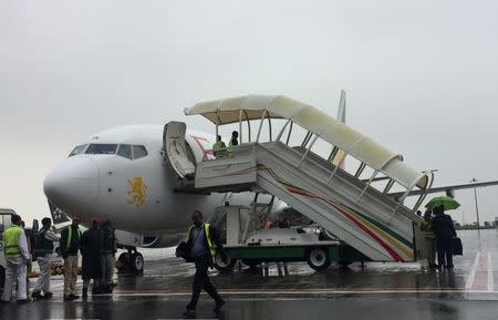 Ethiopian Airlines staff prepare their plane as they resume flights to Eritrea's capital Asmara at the Bole International Airport in Addis Ababa, Ethiopia July 18, 2018. REUTERS/Tiksa Negeri