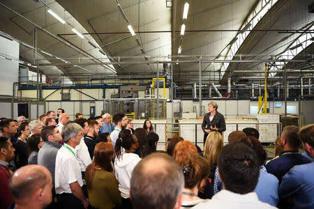 Britain's Prime Minister, Theresa May, addresses staff at GlaxoSmithKline toothpaste factory in Maidenhead, April 21, 2017. REUTERS/Leon Neal/Pool