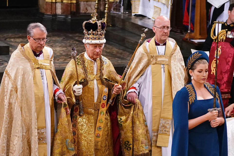 LONDON, ENGLAND - MAY 06: Penny Mordaunt leads King Charles III wearing the St Edward's Crown during his coronation ceremony in Westminster Abbey on May 6, 2023 in London, England. The Coronation of Charles III and his wife, Camilla, as King and Queen of the United Kingdom of Great Britain and Northern Ireland, and the other Commonwealth realms takes place at Westminster Abbey today. Charles acceded to the throne on 8 September 2022, upon the death of his mother, Elizabeth II. (Photo by Yui Mok  - WPA Pool/Getty Images)