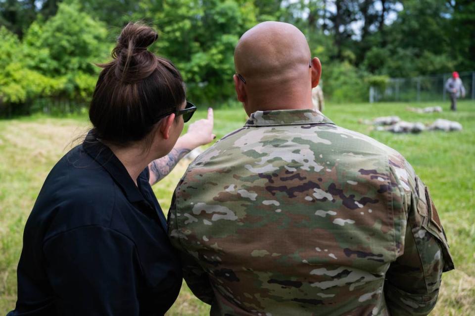 U.S. Air Force Master Sgt. Joel Manspit, 737th Training Group military training instructor school section chief, and Lucinda Lipsett, 737th Training Group Basic Military Training TDE Chief, observe members of the Warrior Airman Readiness Course on Scott Air Force Base. Manspit and Lipsett watched the course for any training opportunities they could implement into BMT.