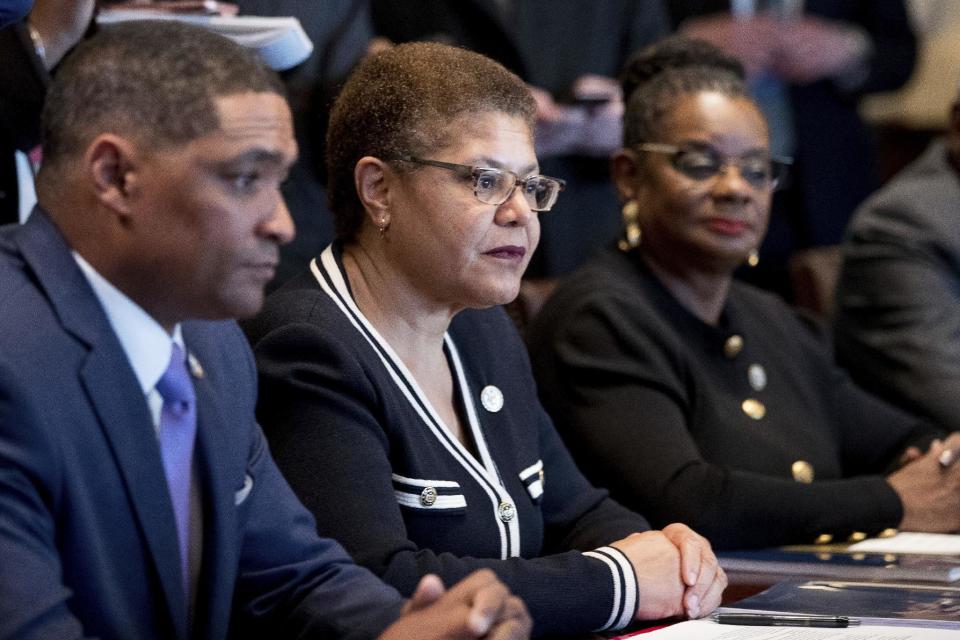 From left, Congressional Black Caucus Chairman Rep. Cedric Richmond, D-La., Rep. Karen Bass, D-Calif., Rep. Gwen Moore, D-Wis., and other members of the Congressional Black Caucus meet with President Donald Trump in the Cabinet Room of the White House in Washington, Wednesday, March 22, 2017. (AP Photo/Andrew Harnik)