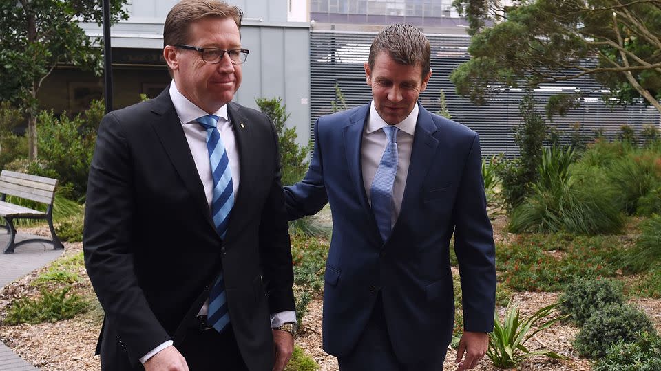 Premier Mike Baird (right) and Deputy Premier Troy Grant, depart following a press conference at NSW Parliament House in Sydney. Photo: