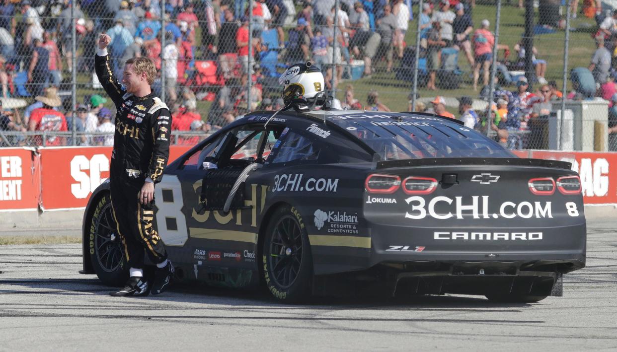 Tyler Reddick waves to the crowd in Turn 5 after winning the NASCAR Cup Series Kwik Trip 250 on July 3 at Road America.