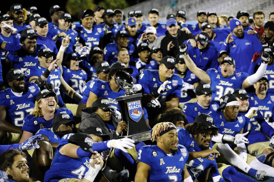Tulsa players celebrate after they defeated Old Dominion in an NCAA college football game in the Myrtle Beach Bowl in Conway, S.C., Monday, Dec. 20, 2021. (AP Photo/Mic Smith)