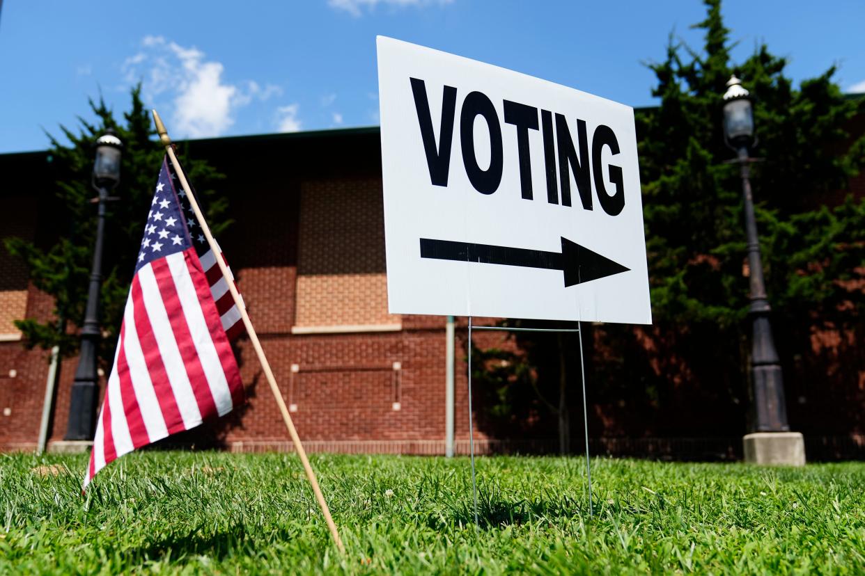 Voting signs instruct people where to cast their ballots during the Aug. 8 special election for Issue 1 at the Schiller Recreation Center in Columbus.