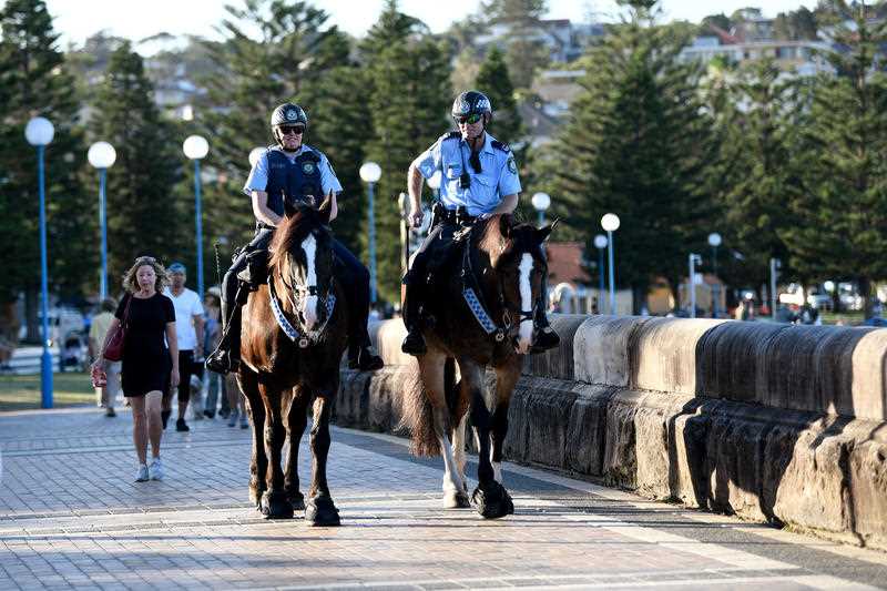 Mounted police are seen patrolling a closed Coogee Beach in Sydney.