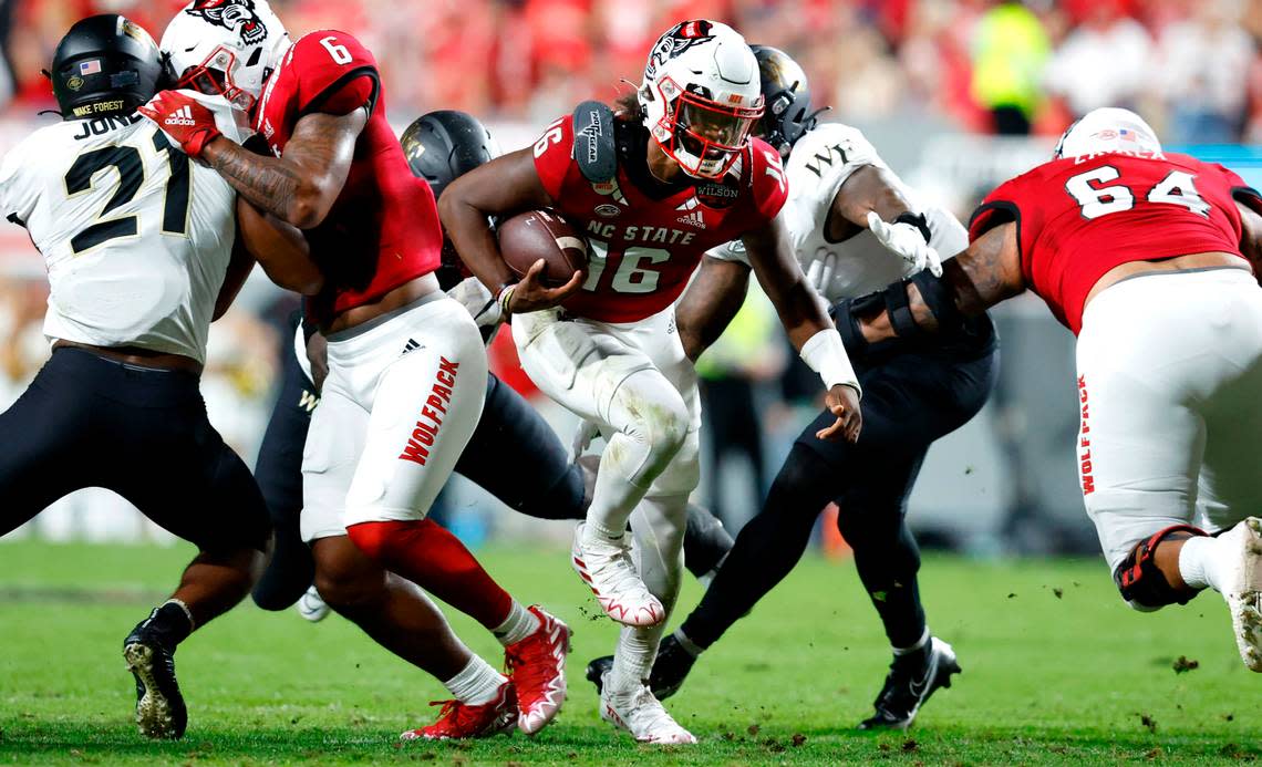 N.C. State quarterback MJ Morris (16) scrambles for yards during the first half of N.C. State’s game against Wake Forest at Carter-Finley Stadium in Raleigh, N.C., Saturday, Nov. 5, 2022.