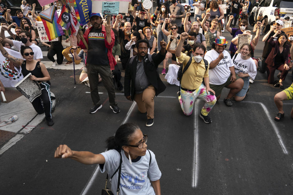 Demonstrators gather outside the Moms for Liberty meeting in Philadelphia, Friday, June 30, 2023. (AP Photo/Nathan Howard)