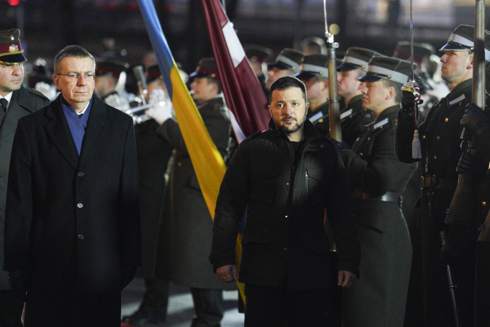 Latvia's President Edgars Rinkevics, second left, and Ukrainian President Volodymyr Zelenskyy attend a welcoming ceremony in Riga, Latvia, Thursday, Jan.11, 2024. (AP Photo/Roman Koksarov)