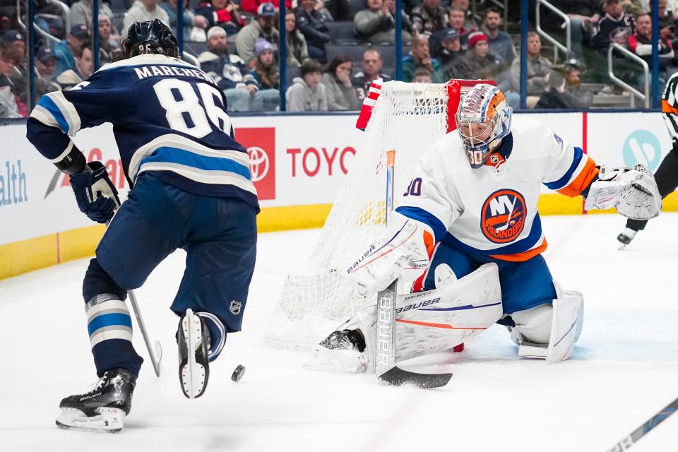 Apr 4, 2024; Columbus, Ohio, USA; New York Islanders goaltender Ilya Sorokin (30) saves a shot from Columbus Blue Jackets right wing Kirill Marchenko (86) during the third period of the NHL hockey game at Nationwide Arena. The Blue Jackets lost 4-2.