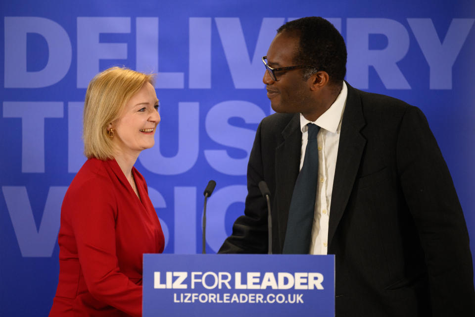 LONDON, ENGLAND - JULY 14: Secretary of State for Business, Energy and Industrial Strategy Kwasi Kwarteng (R) intridcues Conservative leadership candidate Liz Truss (L) as she launches her campaign to become the next Prime Minister on July 14, 2022 in London, England. Liz Truss, the current Foreign Secretary, survived the first round of voting and is in the remaining six candidates vying to become the next Conservative Party leader and Prime Minister. (Photo by Leon Neal/Getty Images)
