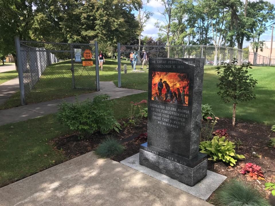 A monument dedicated on the 150th anniversary of the Peshtigo Fire sits outside the Peshtigo Fire Museum in Peshtigo, Wis. on Oct. 1, 2021.