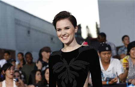 Author Veronica Roth poses at the premiere of "Divergent" in Los Angeles, California in this file photo taken March 18, 2014. REUTERS/Mario Anzuoni/Files