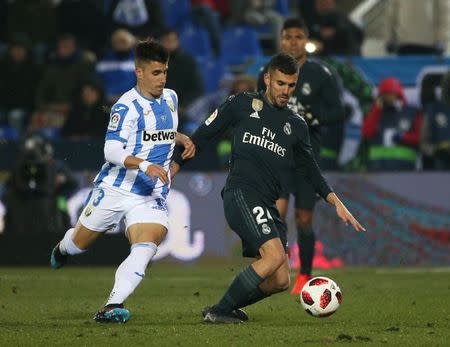 Soccer Football - Copa del Rey - Round of 16 - Second Leg - Leganes v Real Madrid - Butarque Municipal Stadium, Leganes, Spain - January 16, 2019 Leganes' Unai Bustinza in action with Real Madrid's Dani Ceballos REUTERS/Javier Barbancho