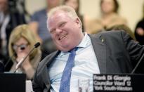 Toronto Mayor Rob Ford laughs during an executive committee meeting in Toronto, December 5, 2013. REUTERS/Aaron Harris (CANADA - Tags: POLITICS)