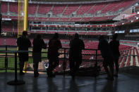 Fans stand in the concourse at Great American Ballpark prior to a baseball game between the Chicago Cubs and the Cincinnati Reds in Cincinnati on Sunday, May 2, 2021. (AP Photo/Jeff Dean)