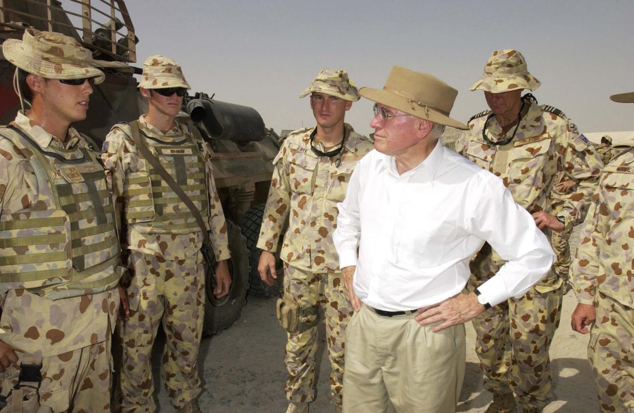 <span>John Howard meets troops in Iraq. A new tranche of 2003 cabinet papers reveal the inner workings of the US-Australia alliance.</span><span>Photograph: Robert Nyffenegger/Department of Defence/AAP</span>