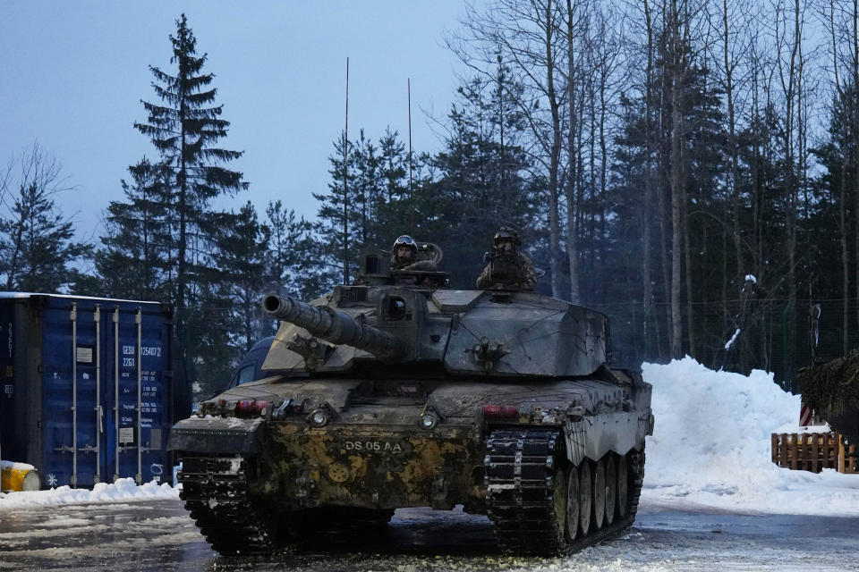 Britain's Challenger 2 tank moves at the Tapa Military Camp, in Estonia, Thursday, Jan. 19, 2023. Senior officials from Britain, Poland, the Baltic nations and other European countries met in Estonia on Thursday before the Ramstein gathering. (AP Photo/Pavel Golovkin)