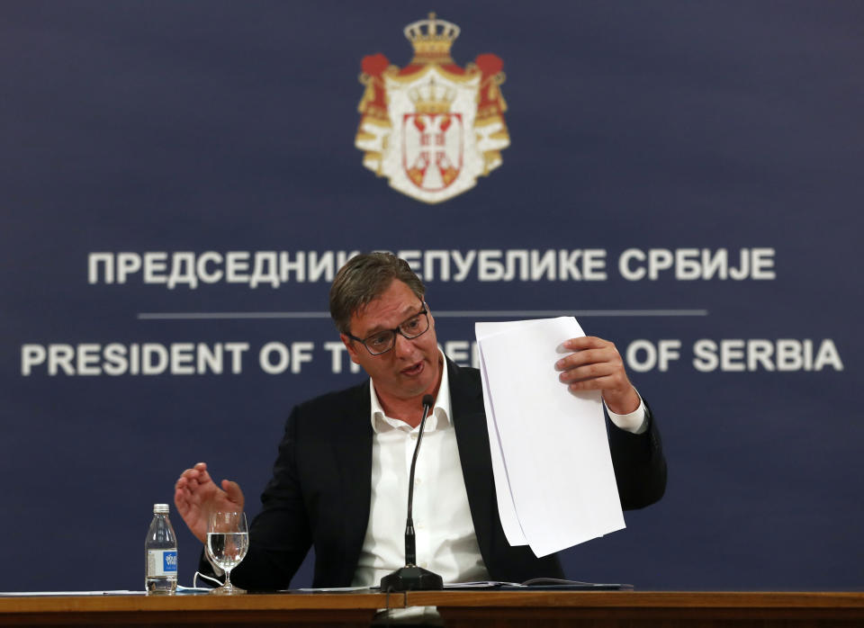 Serbia's President Aleksandar Vucic speaks during a press conference in Belgrade, Serbia, Tuesday, July 7, 2020. Serbia's president has announced the reintroduction of a curfew in Serbia after the highest single-day spike in deaths from the coronavirus. Vucic on Tuesday described the virus situation in Belgrade as "alarming" as hospitals in the capital are leaching their limits. (AP Photo/Darko Vojinovic)