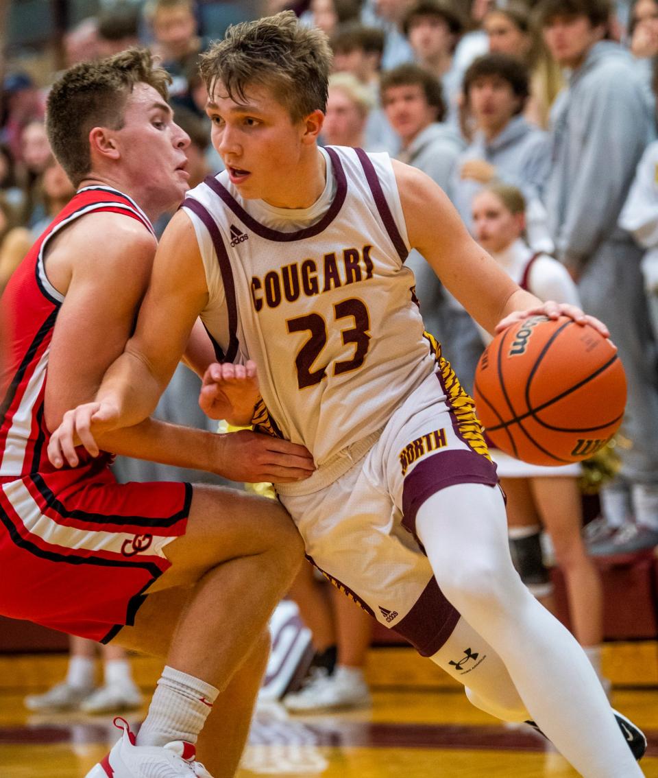 Bloomington North's Gavin Reed drives during the Bloomington North versus Center Grove boys basketball game at Bloomington High School North on Friday, Dec. 2, 2022.