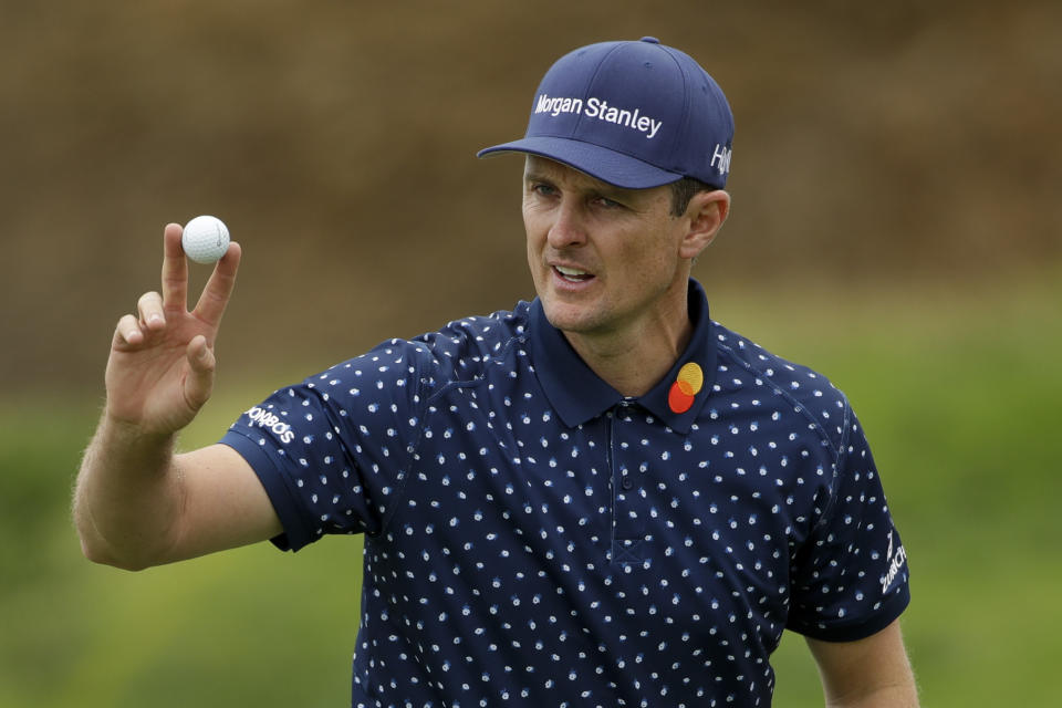 Justin Rose, of England, waves after his putt on the eighth hole during the second round of the U.S. Open golf tournament Friday, June 14, 2019, in Pebble Beach, Calif. (AP Photo/Marcio Jose Sanchez)