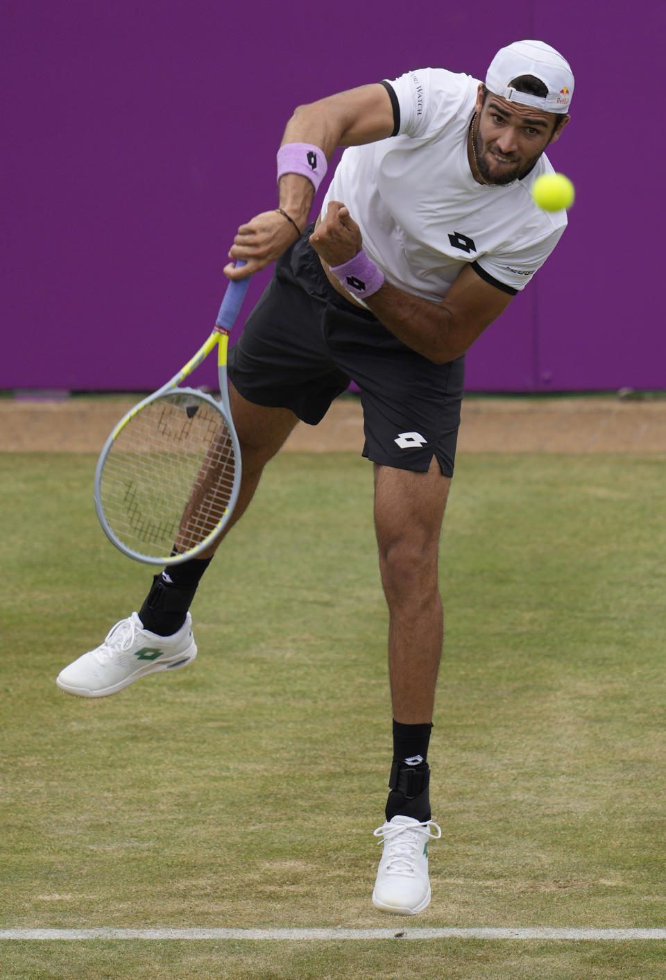 Matteo Berrettini of Italy plays a return to Andy Murray of Britain during their singles tennis match at the Queen's Club tournament in London, Thursday, June 17, 2021. (AP Photo/Kirsty Wigglesworth)