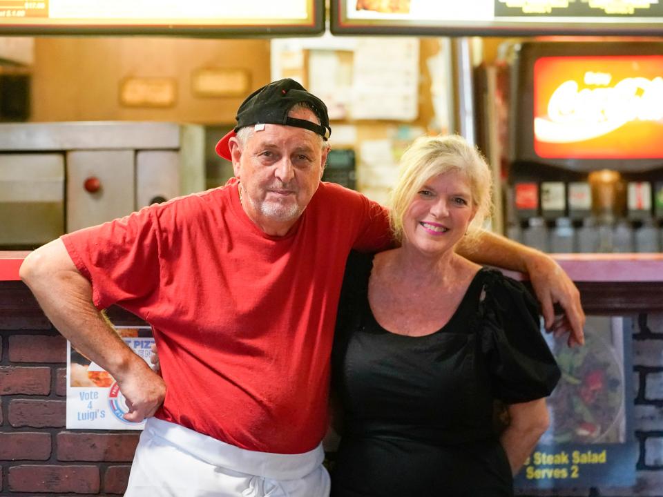 Carlo and Kelly Iantosca pose inside Luigi’s in Naples on March 24, 2023.