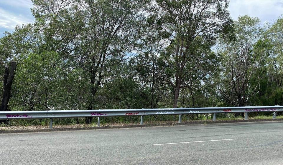 Graffiti along a guard rail on a Gold Coast road near wear the dog was stolen. Source: Facebook