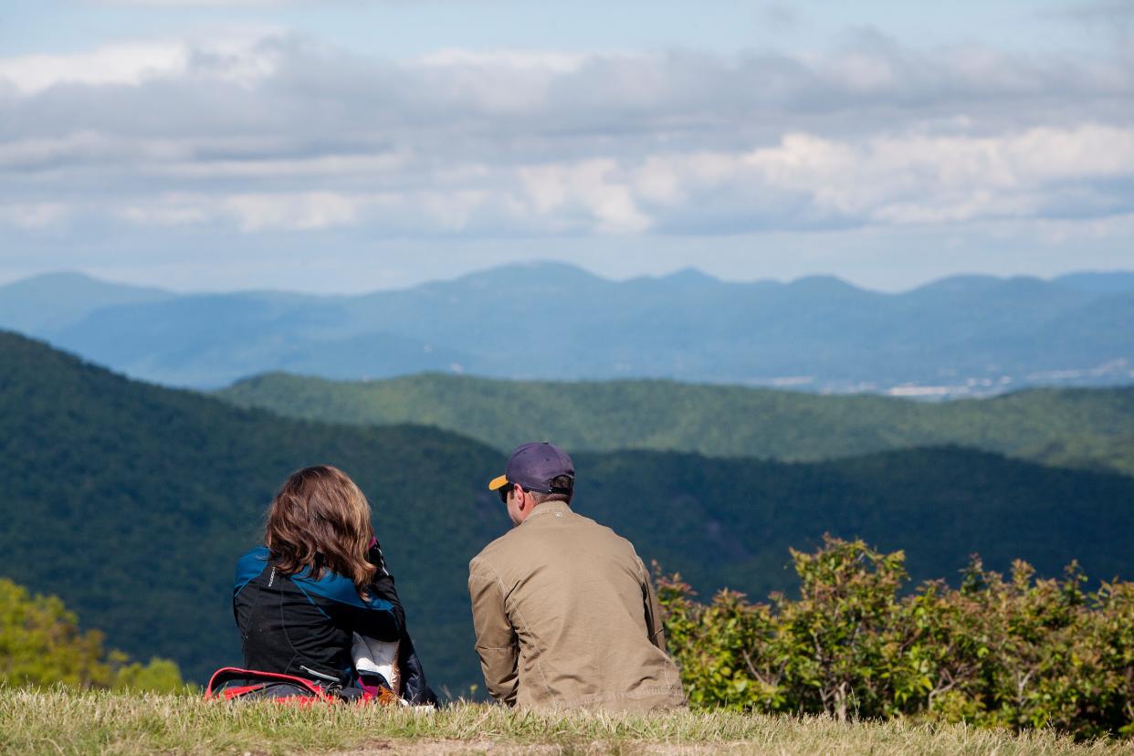 Erin Fondren, left, and Kyle Owens, of Greenville, take a break from motorcycle riding to enjoy a view of the Blue Ridge Parkway during Memorial Day weekend May 30, 2021.