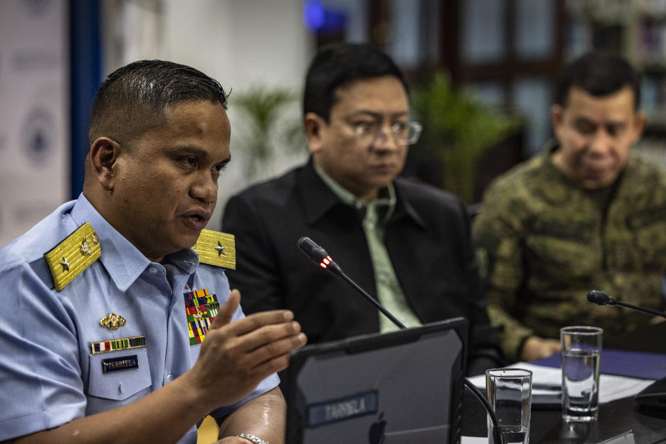Commodore Jay Tarriela, left, Philippine Coast Guard spokesperson for the West Philippine Sea, speaks beside Jonathan Malaya, center, spokesperson for the National Security Council, and Col. Medel Aguilar, spokesperson for the Armed Forces of the Philippines during a press conference on the recent actions by the Chinese Coast Guard against Philippine vessels in the South China Sea, at the Philippine Department of Foreign Affairs in Manila, Philippines on Monday, Aug. 7, 2023. The Philippine government summoned the Chinese ambassador on Monday to convey a diplomatic protest over the Chinese coast guard's use of a water cannon against a Filipino supply boat in the disputed South China Sea, a Philippine official said. (Ezra Acayan/Pool Photo via AP)
