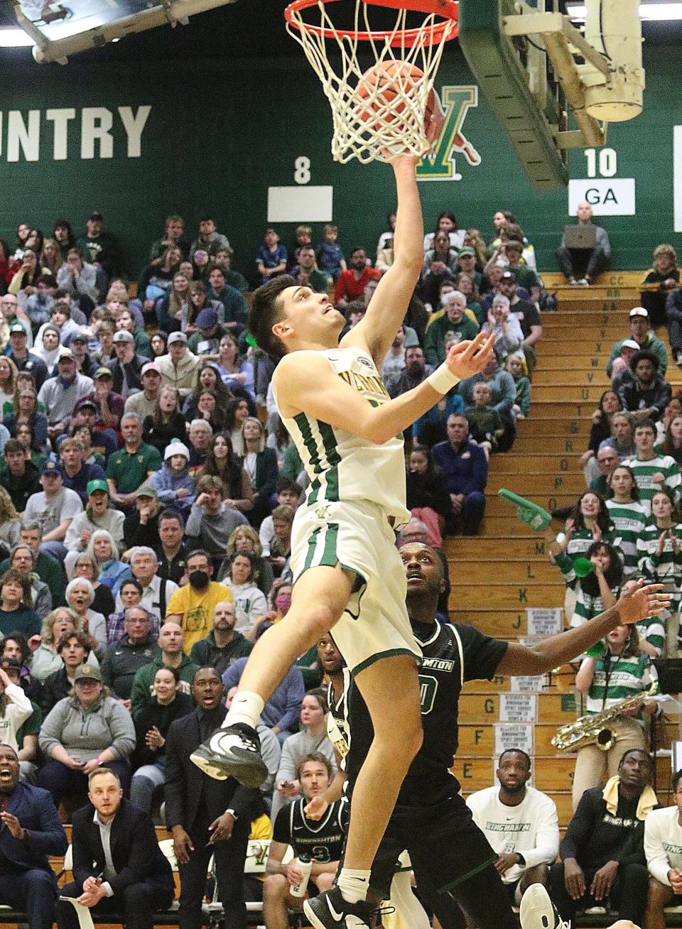 Vermont's Robin Duncan tips a rebound in for 2 points during the Catamounts 79-57 win over Binghamton in the America East semifinals on Tuesday night at Patrick Gym.