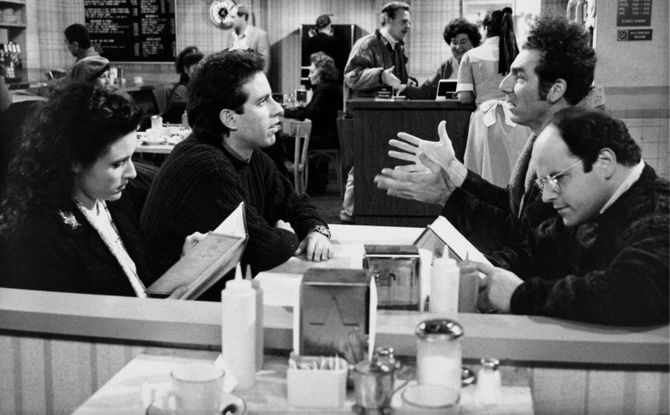 SEINFELD -- "The Kiss Hello" Episode 17 -- Pictured: (l-r) Julia Louis-Dreyfus as Elaine Benes, Jerry Seinfeld as himself, Michael Richards as Cosmo Kramer, Jason Alexander as George Costanza  (Photo by Carin Baer/NBCU Photo Bank/NBCUniversal via Getty Images via Getty Images)