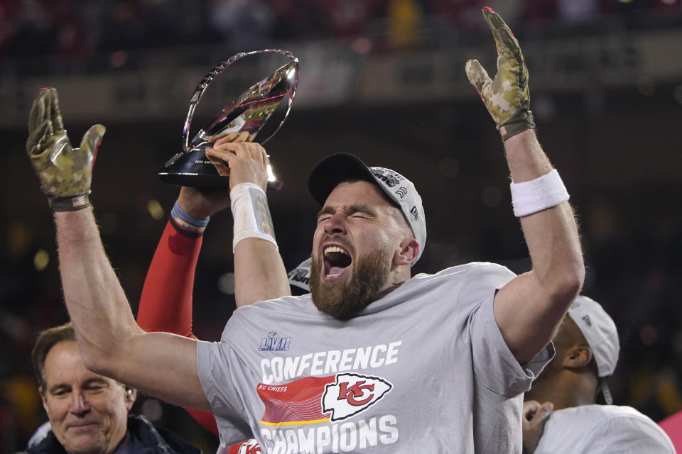 Kansas City Chiefs tight end Travis Kelce celebrates after the NFL AFC Championship playoff football game against the Cincinnati Bengals, Sunday, Jan. 29, 2023, in Kansas City, Mo. The Chiefs won 23-20. (AP Photo/Ed Zurga)