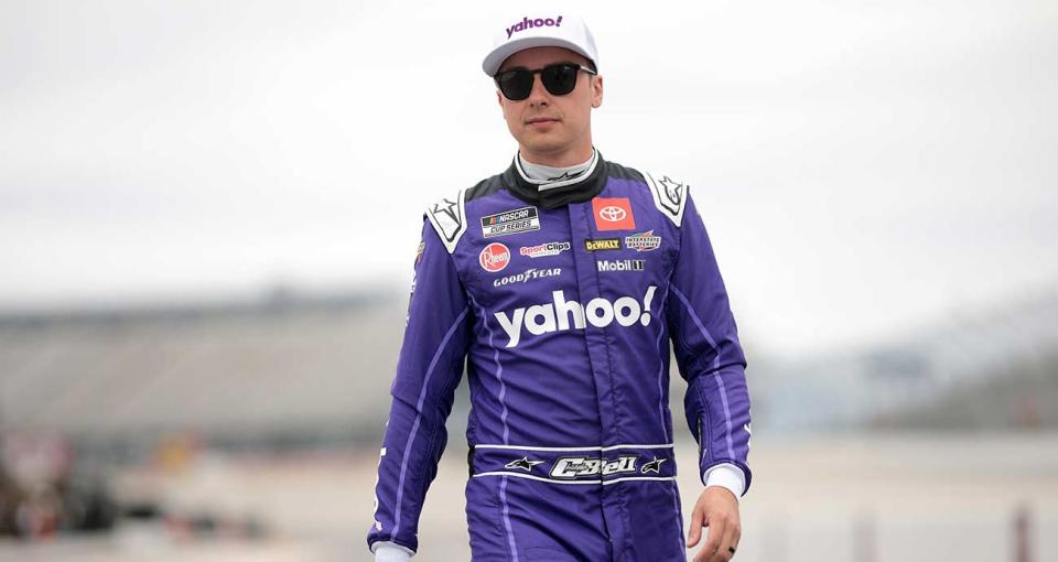 Christopher Bell walks the grid in practice at Dover Motor Speedway