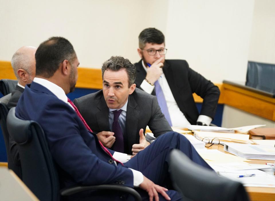 Erica Herman's attorneys discuss her case in Circuit Judge Elizabeth Metzger's courtroom, Tuesday, May, 9, 2023, at 100 S.E. Ocean Blvd. in Stuart. Herman, 39, ex-girlfriend of Tiger Woods, is suing Woods to get out of a nondisclosure agreement, saying she was the victim of his sexual harassment. Woods' attorneys  argued the lawsuit against him should be halted because she signed a nondisclosure agreement requiring that any disagreements between them be settled in private by an arbitrator. Judge Metzer did not give a ruling in court, but is expected to rule this week.