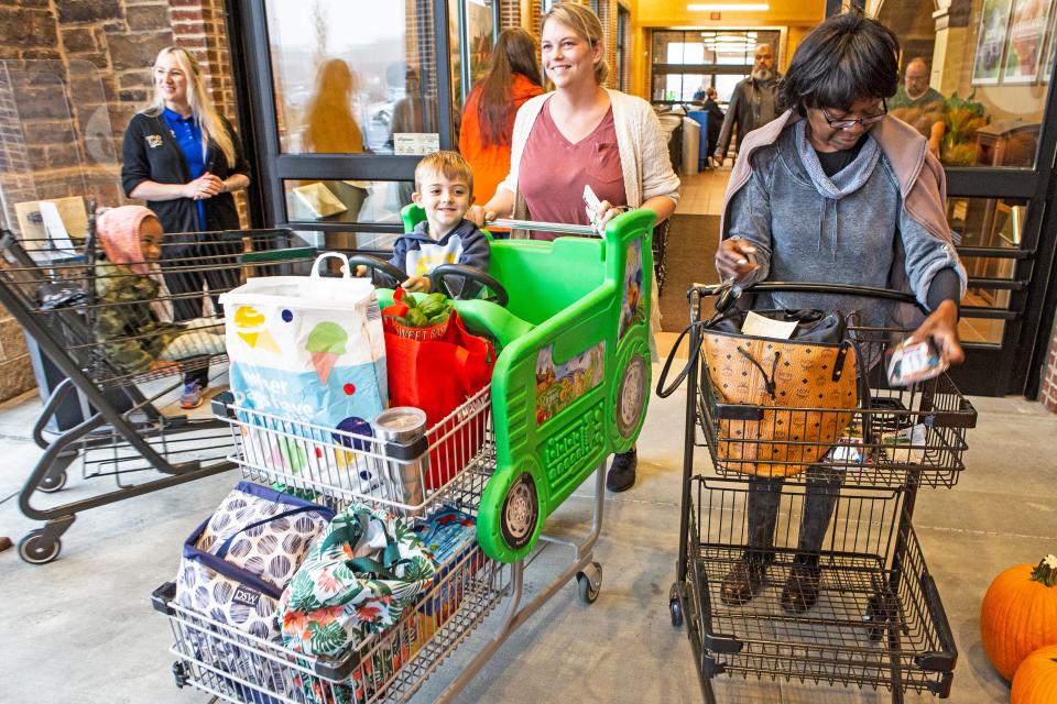 Mom Jessica Keogh and son Declan, 4, enjoy some shopping at the grand opening of Delaware's first Wegmans at the Barley Mill Plaza in Greenville, Wednesday, Oct. 26, 2022.