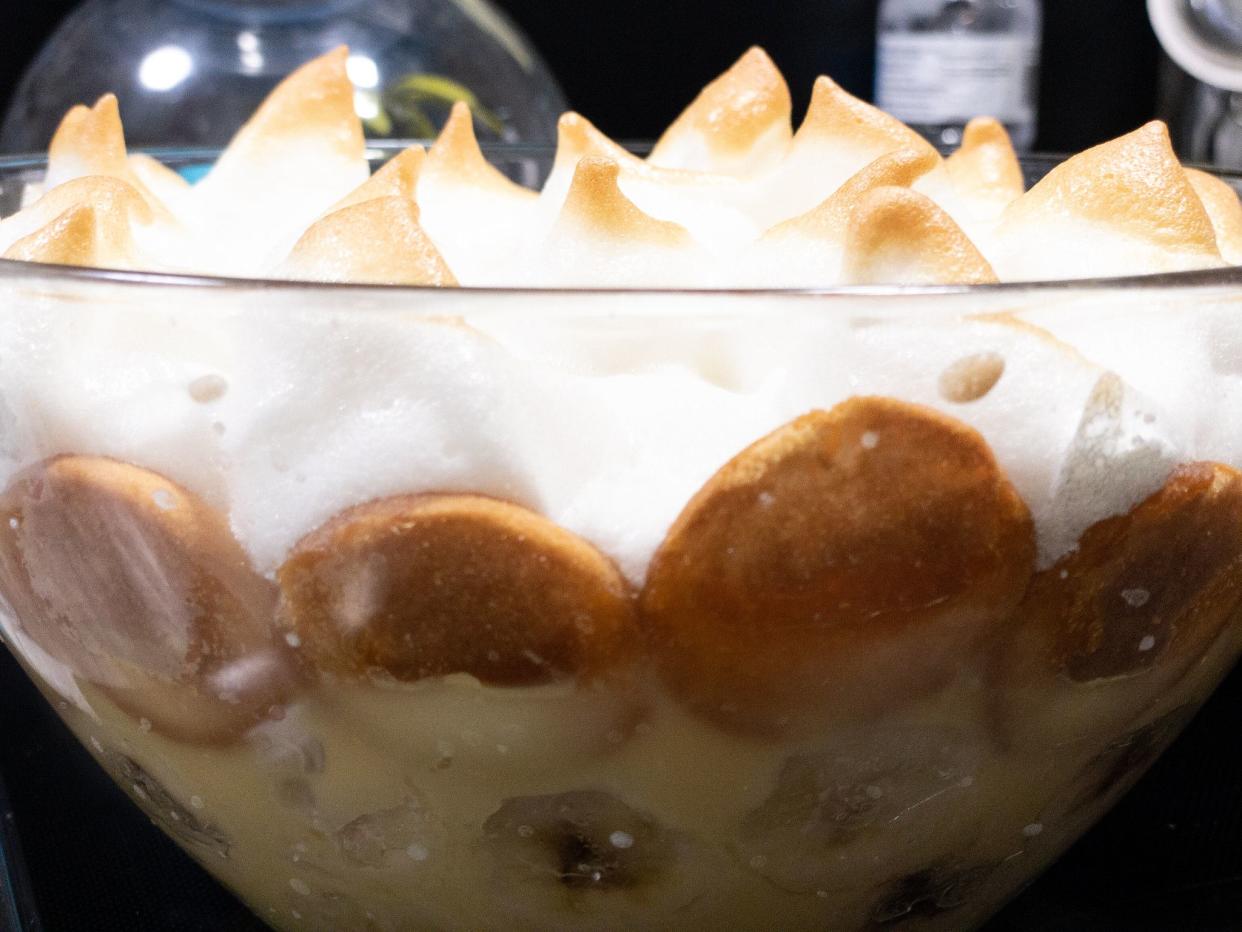 Banana pudding in a clear glass bowl.